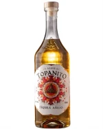 Topanito Tequila Añejo flaske med gyldenbrun væske